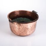 A COPPER POT, 19TH CENTURY With cast-iron swing handle, wear commensurate with age28cm diameter