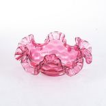 A CRANBERRY GLASS DISH With frill-shaped rim20cm diameter