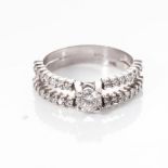 A WHITE GOLD DIAMOND RING Claw-set to the centre with a round brilliant-cut diamond weighing 0,4cts,