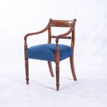 A WILLIAM IV MAHOGANY ARMCHAIR The curved reeded top rail above a barley-twist mid rail, reeded