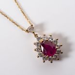 A RUBY AND DIAMOND PENDANT Claw set to the centre with an oval cut Ruby weighing 1,60 carats