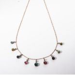 A GEMSTONE NECKLACE Nine gemstones claw set, suspended on links enhanced by a bezel set diamond on a