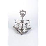 A GEORGE IV SILVER WINE-BOTTLE STAND, THOMAS BLAGDEN & CO, SHEFFIELD, 1828 Clover-shaped,