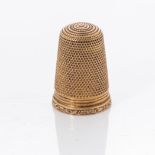 A GOLD THIMBLE 18ct gold, circa 1930s