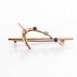 A GOLD BROOCH In the form of an artist’s pallet with diamonds, rubies and sapphires ,9ct gold, circa