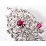 A DIAMOND AND RUBY BROOCH Designed as a Tree of Life claw-set with four oval rubies and round