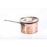 A COPPER SAUCEPAN AND COVER Dents to rim, wear commensurate with age25,5cm wide excluding handle