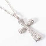 A GOLD PENDANT In the form of a cross, pavé-set with 145 round brilliant-cut diamonds with a