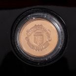 A MANCHESTER UNITED ‘OLD TRAFFORD‘ GOLD PROOF MEDALLION A 22ct gold coin, diameter 28,4mm.