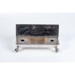 AN EDWARD VII SILVER INK STAND, THOMAS OF NEW BOND STREET, LONDON, 1902 Rectangular, the hinged