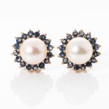 A PAIR OF PEARL AND SAPPHIRE EARRINGS Set to the centre with a pair of 6mm round pearls enhanced