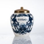 A DUTCH DELFT BLUE AND WHITE 'TOEBACK' TOBACCO JAR, 19TH CENTURY Depicting figures in traditional