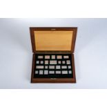 A CASED SET OF STERLING SILVER STAMPS The Queens coronation collection of precious metal replicas