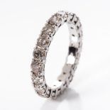 A DIAMOND ETERNITY RING Claw-set with 3,50cts of round brilliant-cut diamonds weighing 3,50cts in
