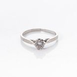 A DIAMOND SOLITAIRE RING Claw set to the centre with a round brilliant cut diamond weight