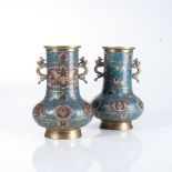 A PAIR OF CHINESE CLOISONNÉ VASES Raised on a splayed foot, each bulbous body rising to a wide
