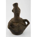 A CHOKWE CLAY VESSEL, ANGOLA The spout modelled in the form of a head, the ovoid body with molded