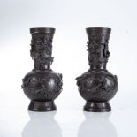 A PAIR OF JAPANESE BRONZE VASES, TAISHO PERIOD 1912-1926 Each raised of a flaring foot, the