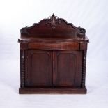 A VICTORIAN MAHOGANY DRESSING TABLE The moulded serpentine top surmounted by two pedestals of