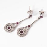 A PAIR OF IOLITE AND DIAMOND EARRINGS Bezel set to the centre with matching Iolites weighing 0,46