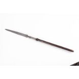 MALAYAN SPEAR c.1800. Cut down wooden shaft. Silver ferrule with heavily-decorated steel head