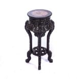 A PAIR OF MISMATCHED CHINESE JARDINERE STANDS The circular marble insets above a key fret border,