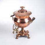 A VICTORIAN COPPER AND BRASS TEA URN The shaped body with opposing scrolling handles with fitted