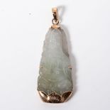 A JADE PENDANT Designed as an elongated Buddha, bezel-set in 9ct yellow gold with a V-hook