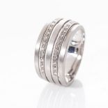 AN 18CT WHITE GOLD RING The alternating bands, five in total, two pavé-set with diamonds with a