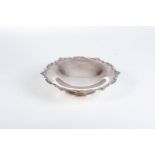 A GEORGE V SILVER FRUIT DISH, LONDON, 1921 Raised on shaped domed foot, the undecorated interior