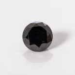 AN UNMOUNTED BLACK DIAMOND round weighing 1,10 carats