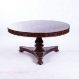 A WILLIAM IV MAHOGANY TABLE The circular top above a plain frieze, faceted support, lobed collar, on