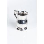 A VICTORIAN SILVER MUG, SAMUEL HAYNE & DUDLEY CATER, LONDON, 1860 Bulbous body, scrolling leaf-