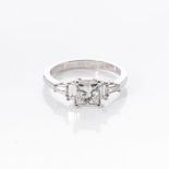 A DIAMOND RING claw set to the centre with a rectangular modified brilliant cut diamond weight 1,