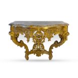 A GILTWOOD AND MARBLE-TOPPED CONSOLE TABLE, 19TH CENTURY The moulded serpentine top above a