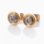 A PAIR OF DIAMOND STUD EARRINGS Bezel-set to the centre with a pair of diamonds weighing 0,46cts,
