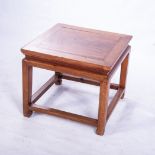 A CHINESE SIDE TABLE, LATE 19TH CENTURY The framed square top above a plain frieze, on square-