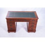 A VICTORIAN MAHOGANY PEDESTAL DESK The rectangular top with a gilt-tooled leather inset leather