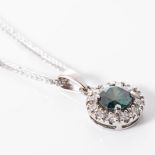 A DIAMOND PENDANT Claw-set to the centre with an enhanced natural green round diamond, surrounded by