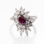 A RUBY AND DIAMOND RING Claw-set to the centre with a pear-shaped ruby weighing approximately 0,