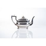 A GEORGE III SILVER TEA POT, LONDON, 1803 Rounded rectangular, the hinged cover with turned