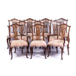 A SET OF TEN GEORGE III STYLE DINING CHAIRS Comprising: two carvers and eight side chairs, each