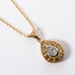 A DIAMOND PENDANT Claw set to the centre with an oval natural fancy yellow diamond surrounded by 8