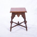 AN OAK TABLE, LATE 18TH CENTURY With a panelled square top above a carved apron with roundels,