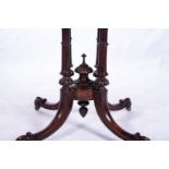 A VICTORIAN MAHOGANY CARD TABLE The hinged swivelling moulded rectangular top enclosing a