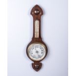 A MAHOGANY ANEROID BANJO BAROMETER Circular white dial with brass bezel below a central