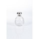 A SILVER TOPPED SCENT BOTTLE The top marked for London, maker's mark rubbed11cm high