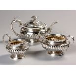 A GEORGE IV SILVER ASSEMBLED THREE PIECE TEA SERVICE