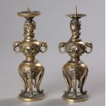 A PAIR OF JAPANESE BRASS 'ELEPHANT-HANDLE' CANDLESTICKS, MEIJI PERIOD, 1868-1912