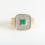 AN EMERALD AND DIAMOND RING